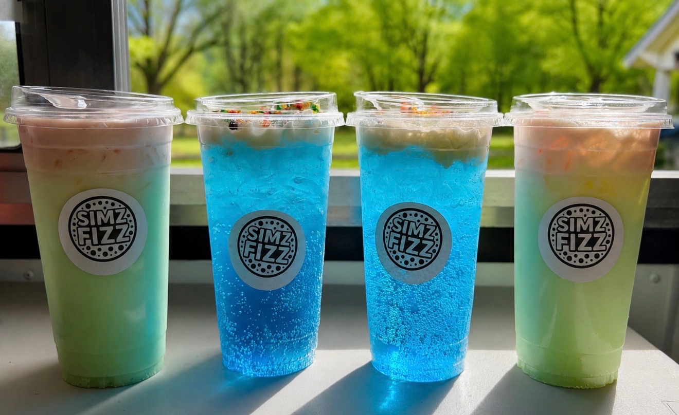 Four colorful SIMZ FIZZ dirty sodas lined up on the truck window ledge.